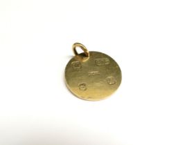 A 9ct gold circular pendant, 3.2cm diameter, 17.8g