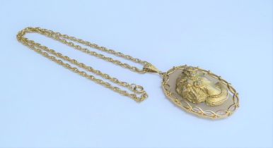 An oval agate with 9ct gold cameo of female with seven diamonds studded in her hair in a 9ct gold