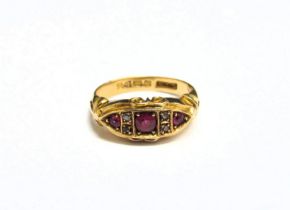 An 18ct gold ring with three rubies spaced by two diamonds. Size M, 5.8g