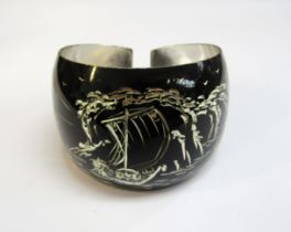 A Japanese silver bangle, the black ground with etched image of mount Fuji and a junk boat, 28.2g