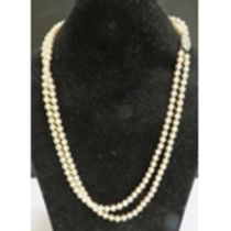 A double strand pearl necklace with diamond set clasp stamped 750, 55cm long, with purchase receipt
