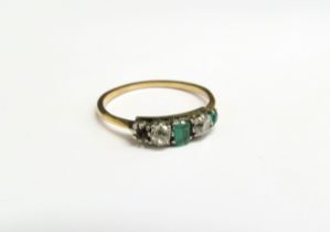 An emerald and diamond ring, unmarked gold, end emerald missing. Size P, 1.9g