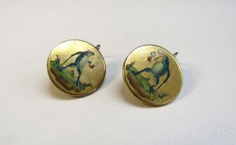 A pair of earrings depicting in enamels a frog with walking cane smoking a pipe, 18mm diameter