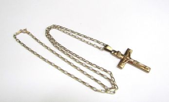 A 9ct gold crucifix pendant hung on 9ct gold chain, 4.9g