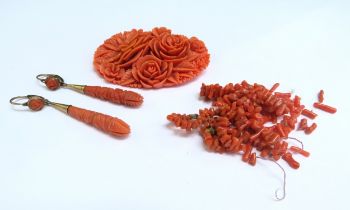 A large carved coral coloured plastic/resin, brooch, 6.5cm x 4cm, a pair of carved coral torpedo