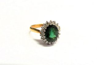 An 18ct gold tourmaline and diamond cluster ring. Size M, 4.5g