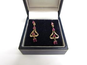 A pair of 9ct gold ruby and diamond drop earrings, 2.5cm drop, 2.1g