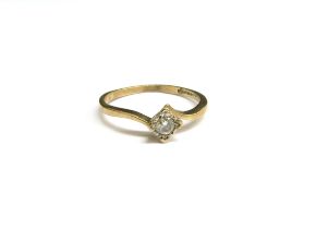 A 9ct gold diamond solitaire ring, illusion set stone in square setting, 0.10ct. Size Q, 1.6g