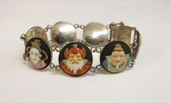 A Toshikane Japan silver seven panel bracelet, each circular panel depicting a sage, 18cm long
