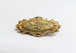 An unmarked gold bar brooch with seed pearl flower centre, 3.4g