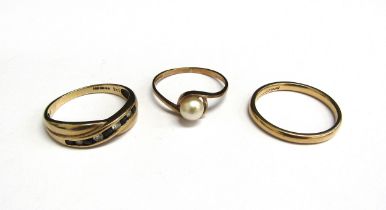 A 9ct gold wedding band, size P and two 9ct gold dress rings including pearl set example, 5g