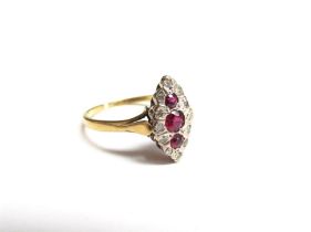 An 18ct gold ruby and diamond navette ring. Size N, 2.7g