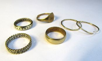 A 9ct gold wedding band, size N, 9ct gold hoop earrings, 9ct gold signet ring (cut) and two eternity