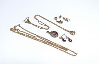 Two 9ct gold necklaces, 50cm and 40cm long hung with pear drop pendants, with two pairs of