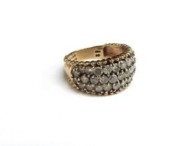 A gold ring with three rows of diamonds, 2ct total, stamped 10k. Size N, 4.7g