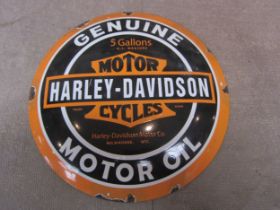 A reproduction circular convex Harley Davidson enamel sign "Genuine Motor Oil", 29.5cm diameter