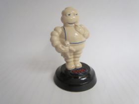A ceramic Michelin Man style reproduction Esso figurine