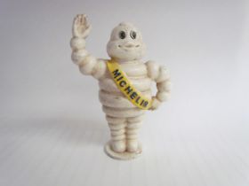A reproduction cast waving Michelin Man, 22cm tall