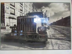 Two framed photographs including a truck and a Ferrari. 50cm x 40cm and 51cm x 40cm