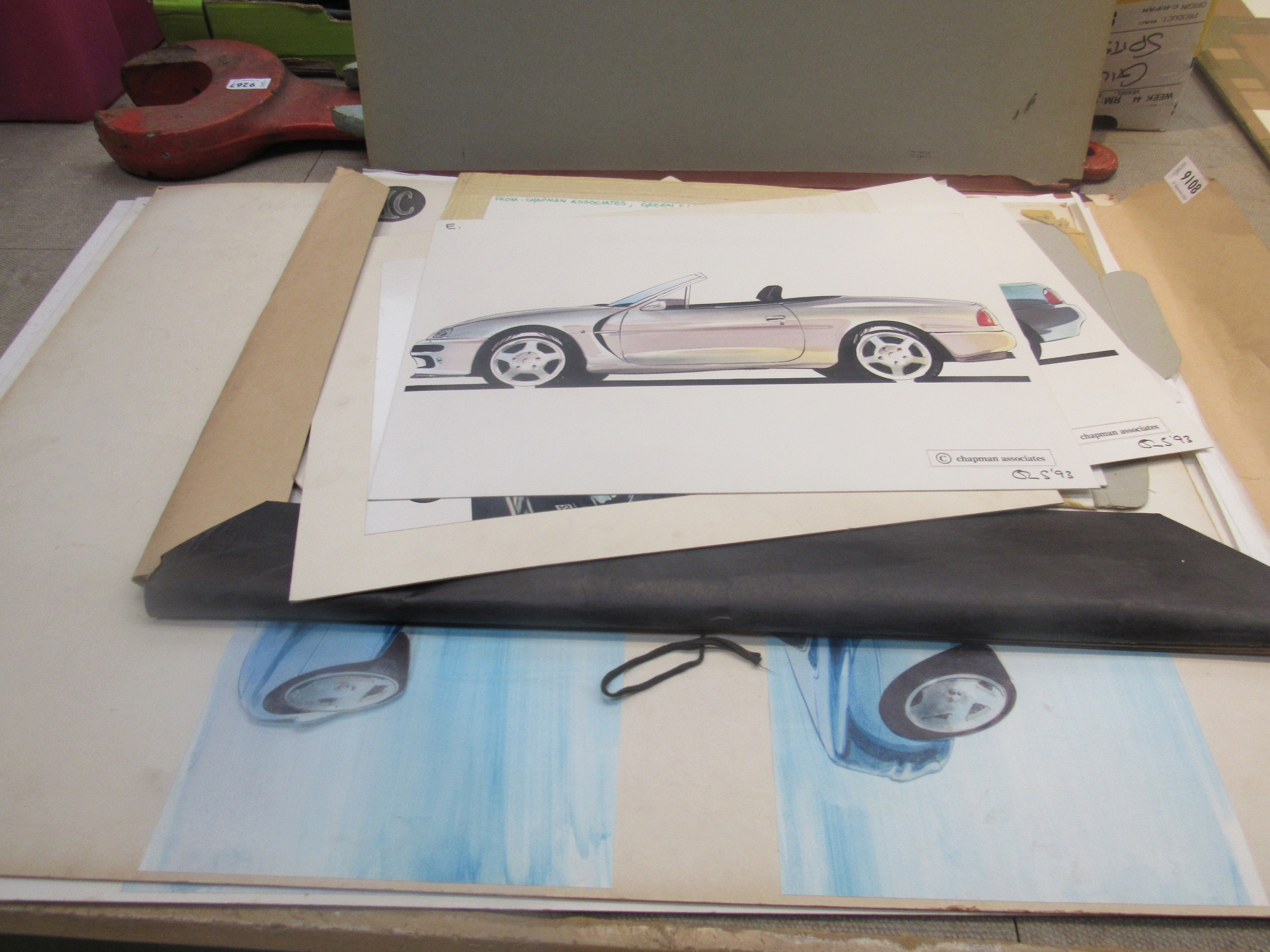 A folder and two mounted designs of AC prototype factory original drawings. Approx. 60 in total