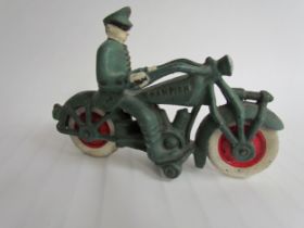 A cast reproduction Postal motorcyclist