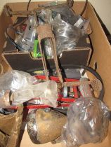 A box of mixed autoparts including a lamp, footpump, gromits and spares