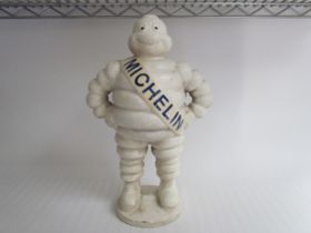 A reproduction standing cast Michelin Man, 37cm tall