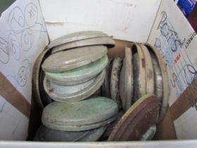 A box containing a quantity of assorted vintage car hubcaps including Ford, BMW and VW