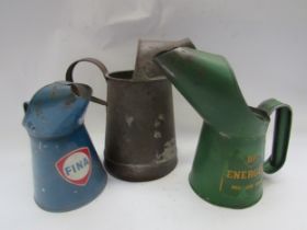 Three oil jugs, Fina, BP and an unnamed