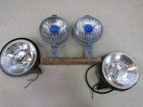 A mounted pair of Notek lamps and a pair of chromed lamps