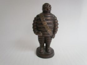 A hollow cast bronze Michelin Man "MITCELINITRES", 25cm tall