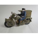 A cast reproduction Parcel Post Rider on motorcycle with sidecar