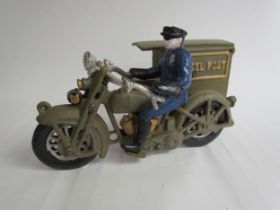 A cast reproduction Parcel Post Rider on motorcycle with sidecar