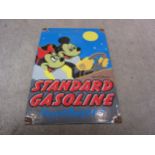 A reproduction "Standard Gasoline, Unsurpassed" Walt Disney enamel sign, 20cm x 30cm