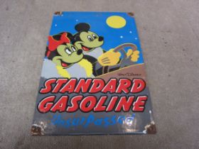 A reproduction "Standard Gasoline, Unsurpassed" Walt Disney enamel sign, 20cm x 30cm