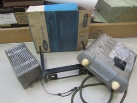 A Ford valve radio, power pack and a boxed Ford radio fascia