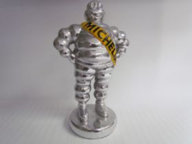 A chromed reproduction Michelin Man, 35cm tall