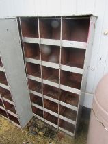 A vintage 24 pigeon hole workshop cabinet