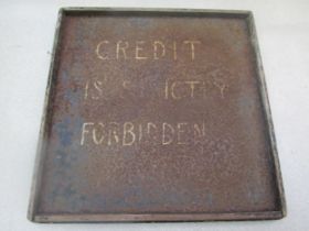 A hand written 'Credit is strictly forbidden' tin garage sign. 44cm x 43cm