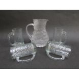 Four Ravenhead Glass tankards in clear textured glass and a simialr 'Glacier' style jug. Tallest