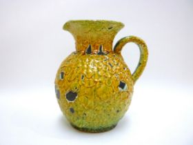 A Charles Cart Mid 20th Century French Le Cyclope studio pottery jug in yellow and green "blistered"