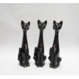Three Italian Pottery figures of cats with black glaze, 34cm high