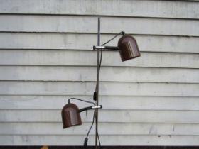 A Danish standard lamp with twin adjustable spots in brown and chromed metal