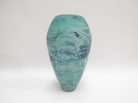 A studio art glass vase in turquoise with blue mottling. Faint indistinct signature to base edge and