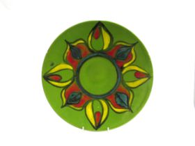 A Poole Pottery Delphis Charger in green, red and yellow colours, 35cm diameter