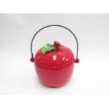 A large pottery tureen in the form of a tomato with wire handle. 23cm high