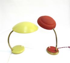 Two painted metal European 'hooded' adjustable desk lamps, one in red, one yellow