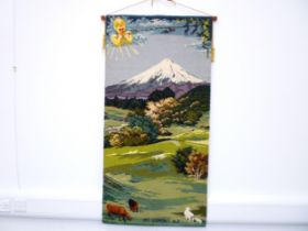 A wall hanging depicting Mount Edgmont (Taranaki) designed by B. Hartwell and made by Feltex