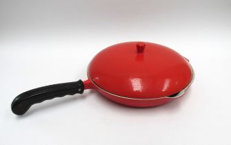 A Danish cast iron frying pan and cover in red. 31cm diameter