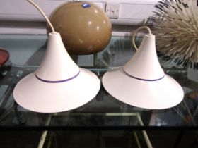 A pair of Danish ceiling lights, model Riva, of flared form in white and purple. 25cm diameter